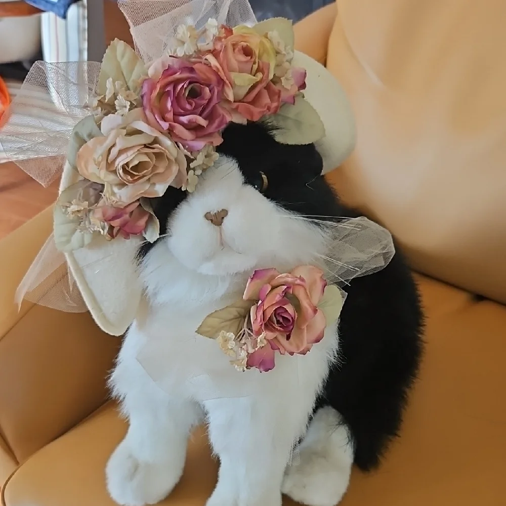 Black and White Plush Cat with flowered hat.
